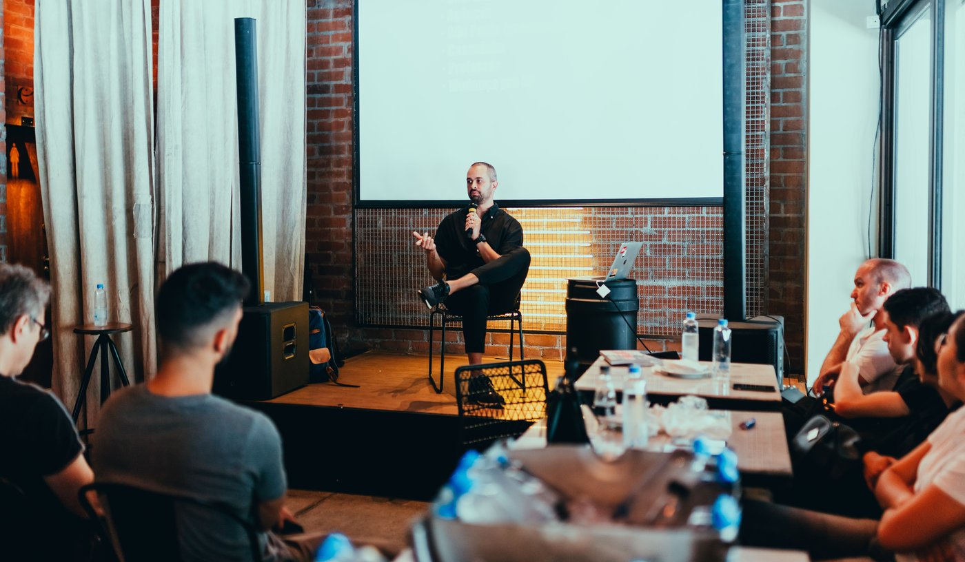 Man speaks at industry event to a crowd